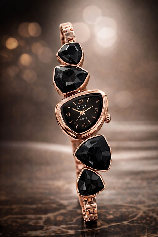 Luxury watch with black gemstones and rose gold casing on a dark background
