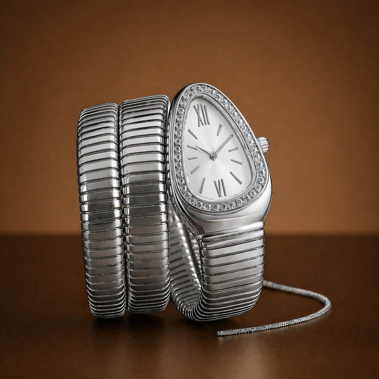 Silver watch with a textured band on a brown background