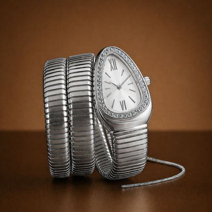 Silver watch with a textured band on a brown background