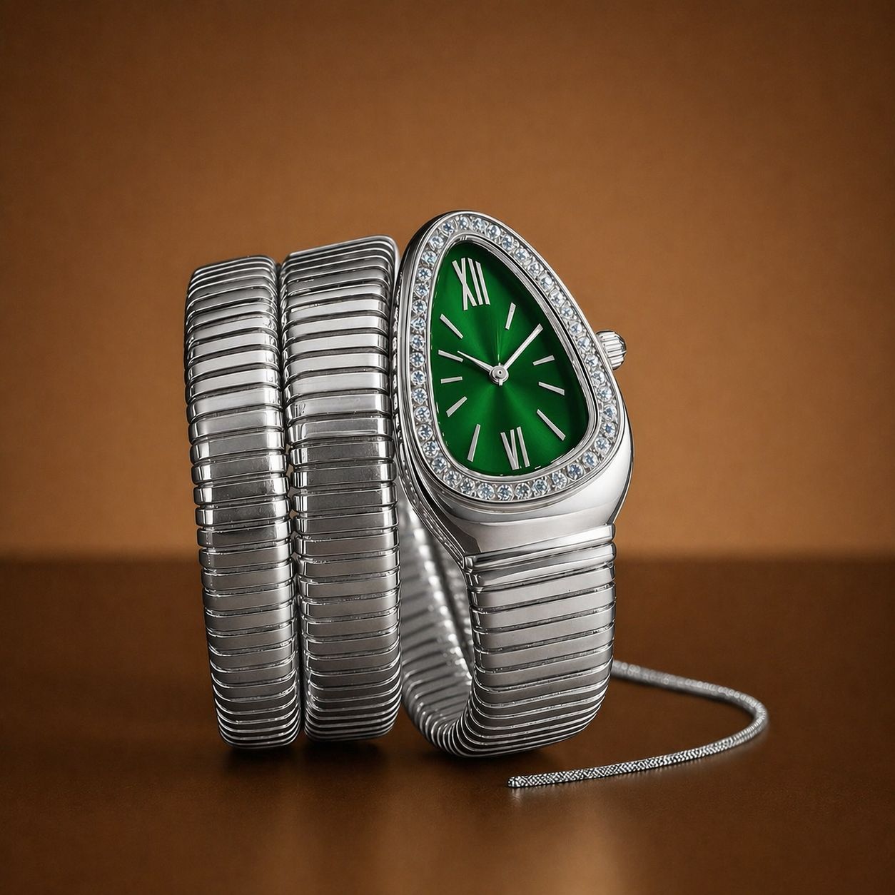 Silver watch with a green face on a brown background