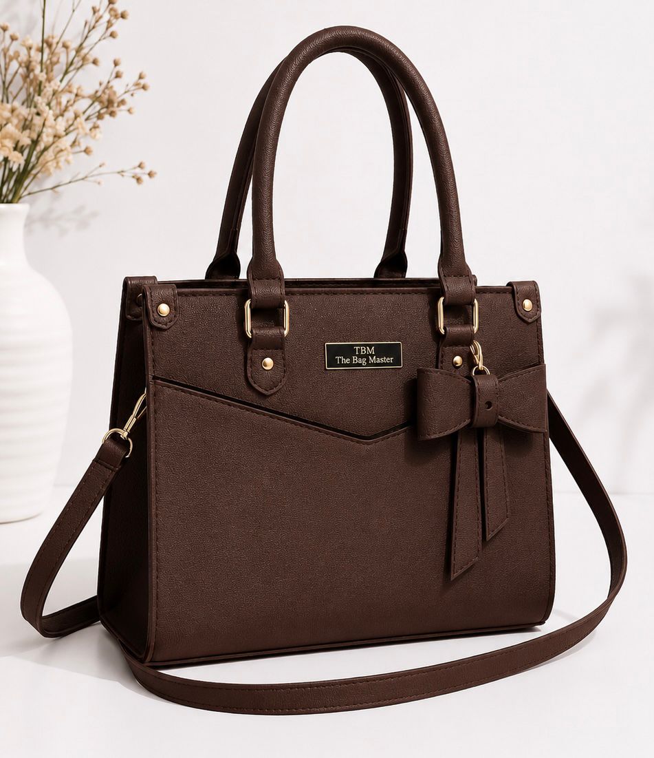 Brown handbag with a bow detail on a white background