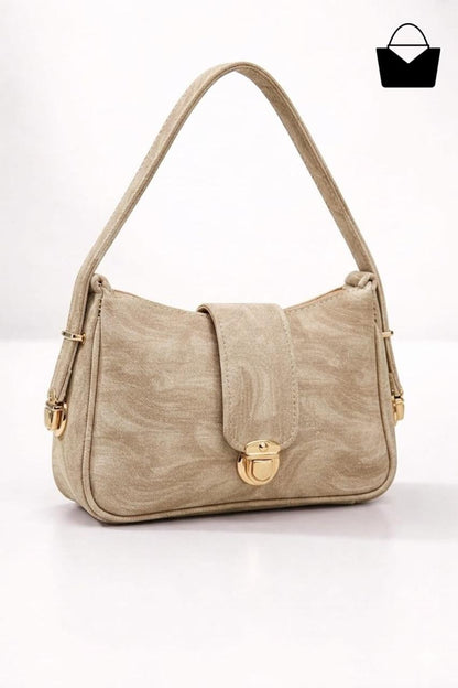 Beige handbag with gold accents on a white background