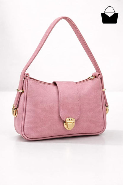 Pink handbag with gold accents on a white background