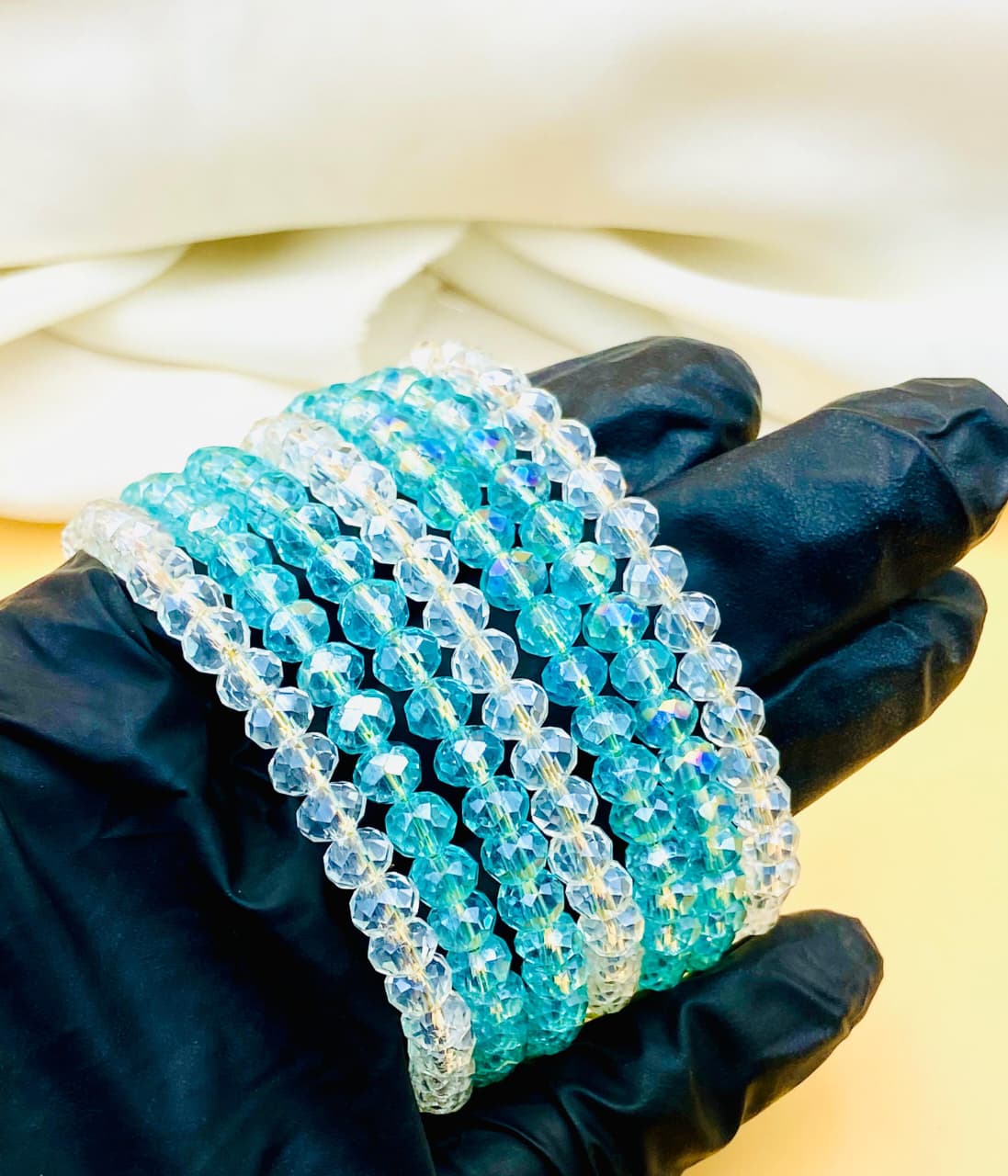 Elegant 7-piece blue and clear crystal bracelet set for women featuring sparkling faceted beads, perfect for parties, weddings, gifting, and everyday fashion.
