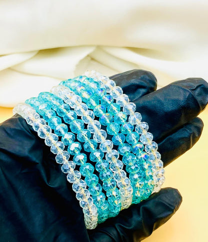 Elegant 7-piece blue and clear crystal bracelet set for women featuring sparkling faceted beads, perfect for parties, weddings, gifting, and everyday fashion.