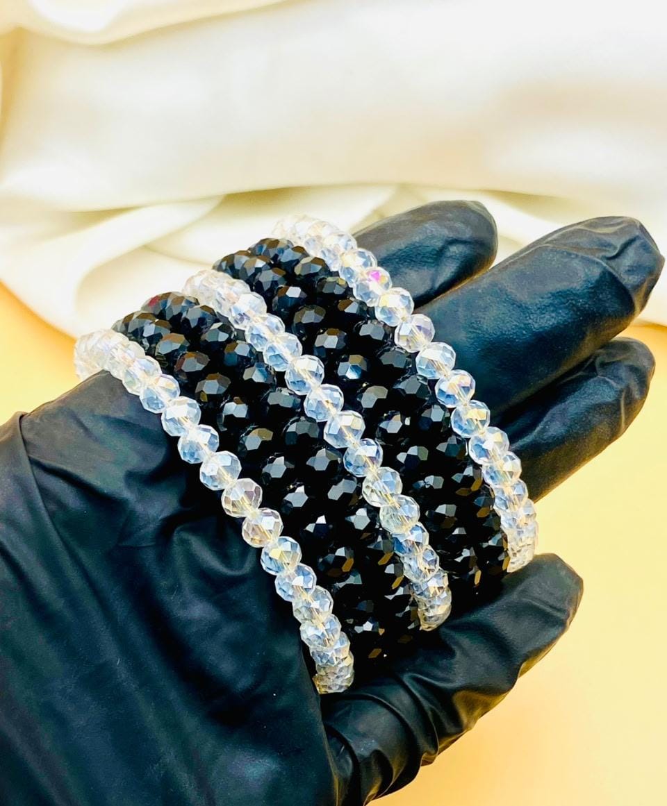 Elegant 7-piece black and clear crystal bracelet set for women featuring sparkling faceted beads, perfect for parties, weddings, gifting, and everyday fashion.