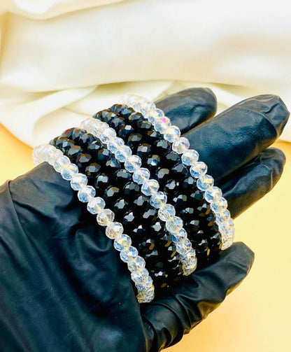 Elegant 7-piece black and clear crystal bracelet set for women featuring sparkling faceted beads, perfect for parties, weddings, gifting, and everyday fashion.