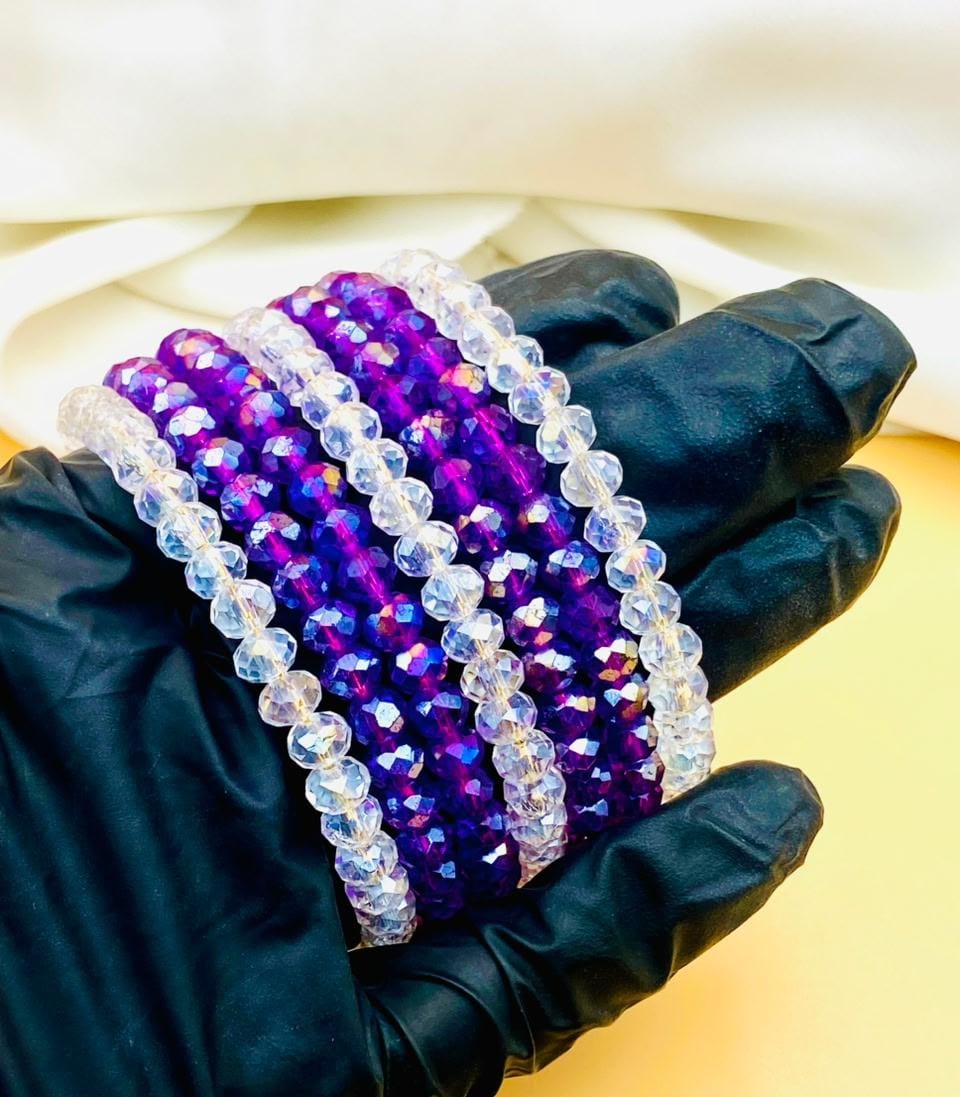 Elegant 7-piece purple and clear crystal bracelet set for women featuring sparkling faceted beads, perfect for parties, weddings, gifting, and everyday fashion.