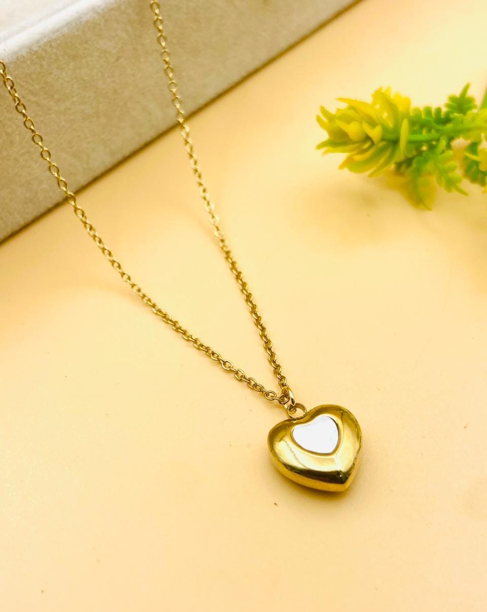 Premium heart-shaped stainless steel pendant necklace for women featuring a durable gold-tone chain and timeless minimalist design.