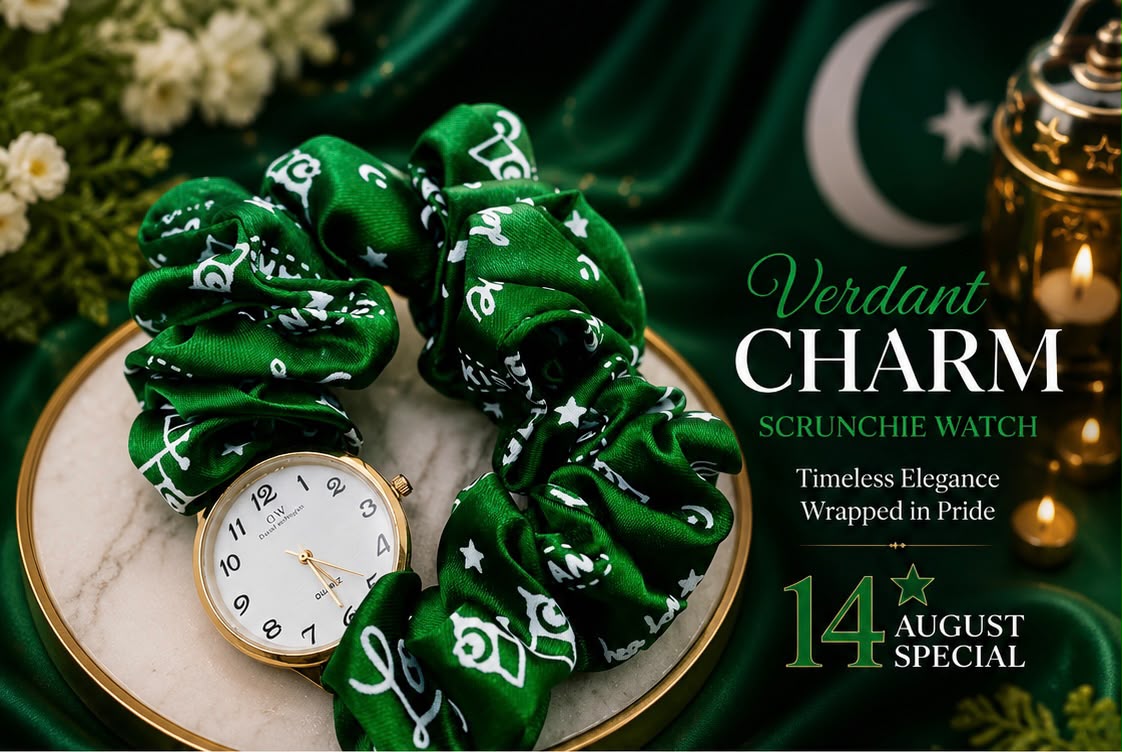 Green bandana-print scrunchie watch with a gold-tone case and white dial, styled on a marble plate with green fabric, flowers, and a lantern in the background. Text on the right reads 'Verdant CHARM SCRUNCHIE WATCH' and '14 AUGUST SPECIAL'.